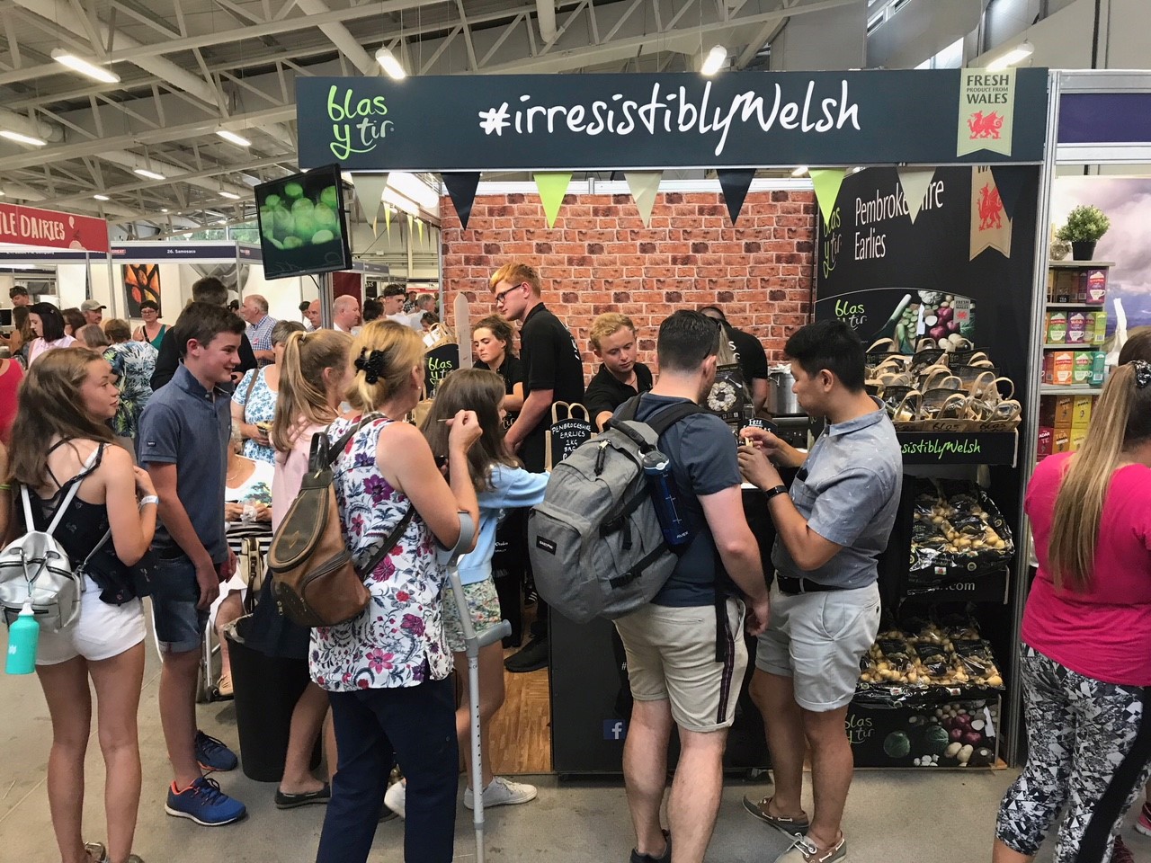 Visitors at the Blas y Tir Stand at the Royal Welsh Show 2018
